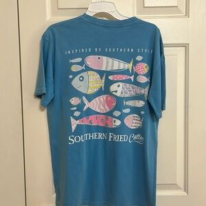 Southern Fried Cotton Blue Tee Shirt with front pocket and fish design on back